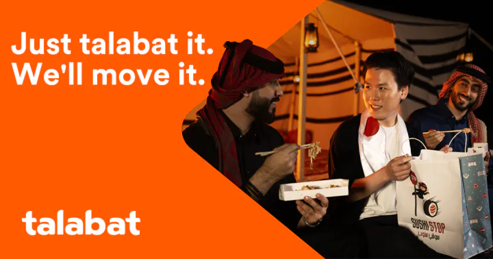 Key creative — three men sit in a lantern-lit tent eating from takeaway boxes, a Sushi Stop bag in the foreground, beside the orange panel and the talabat logo