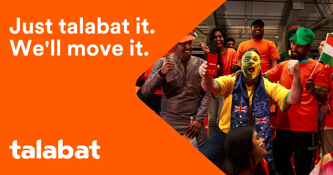 Talabat — Football Cultures key creative: fans in orange shirts cheer around a man with a green-and-yellow painted face